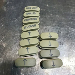 plastic light button engraved